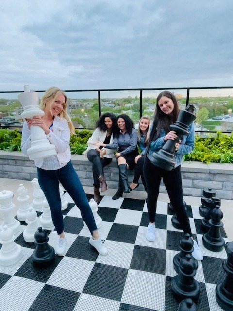 Friends Playing Chess at Residences at Addison Clark Apartments, Chicago
